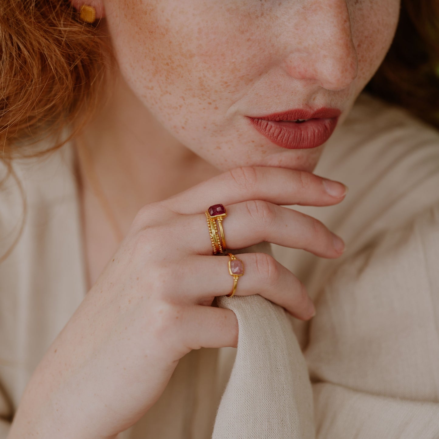 Unique artisan ring crafted in rich gold, adorned with a small hand-cut light pink tourmaline.