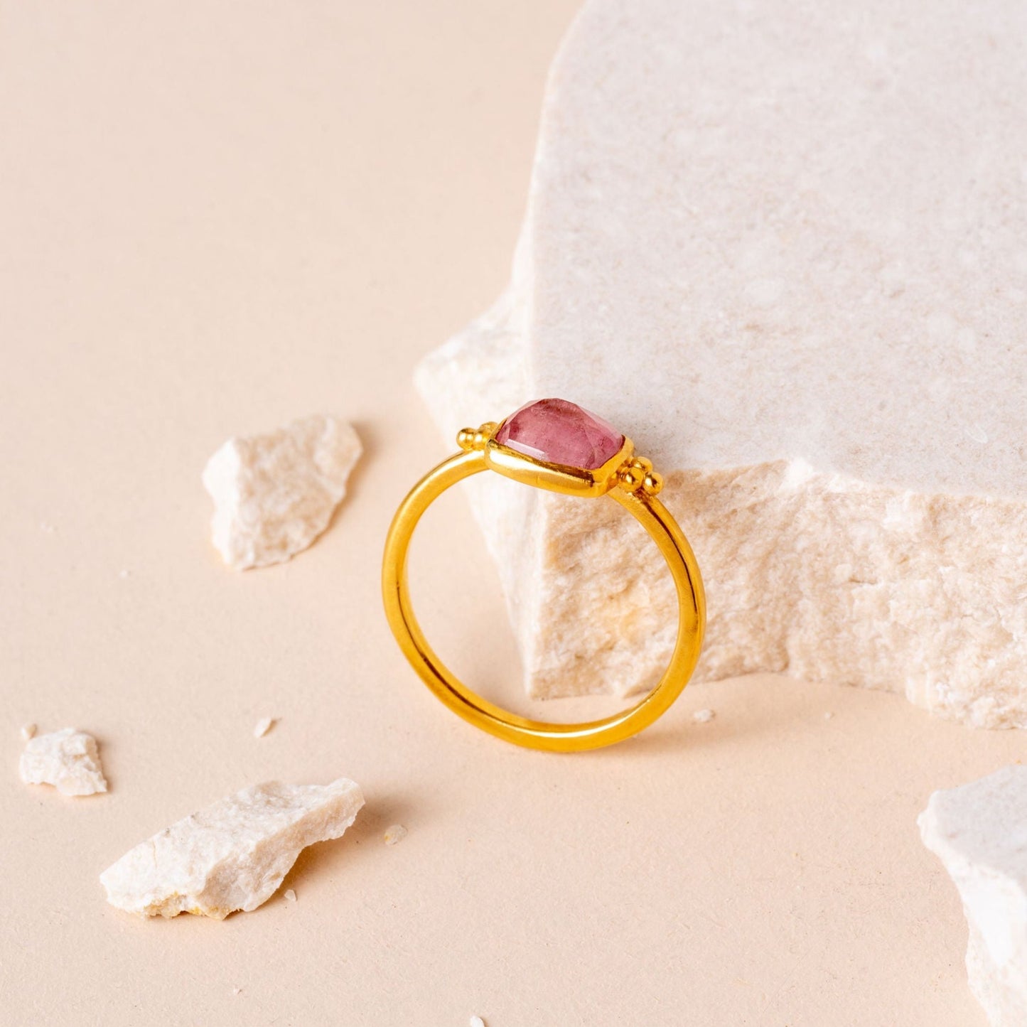 Artisan-crafted gold ring with fine granulation details and a lovely hand-cut light pink tourmaline.